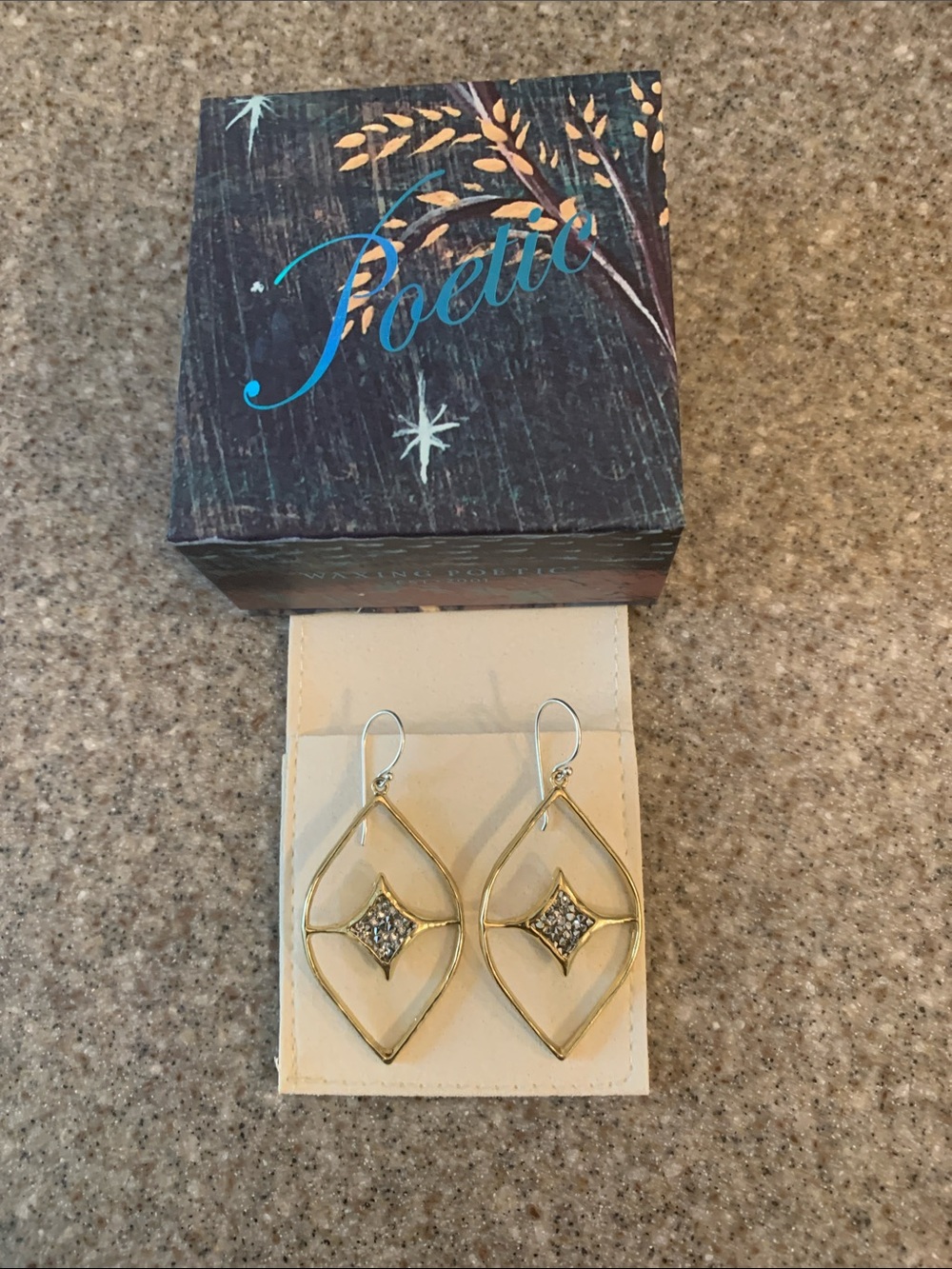 Poetic Gold-Tone Dangle Earrings with Rhinestone Center Detail